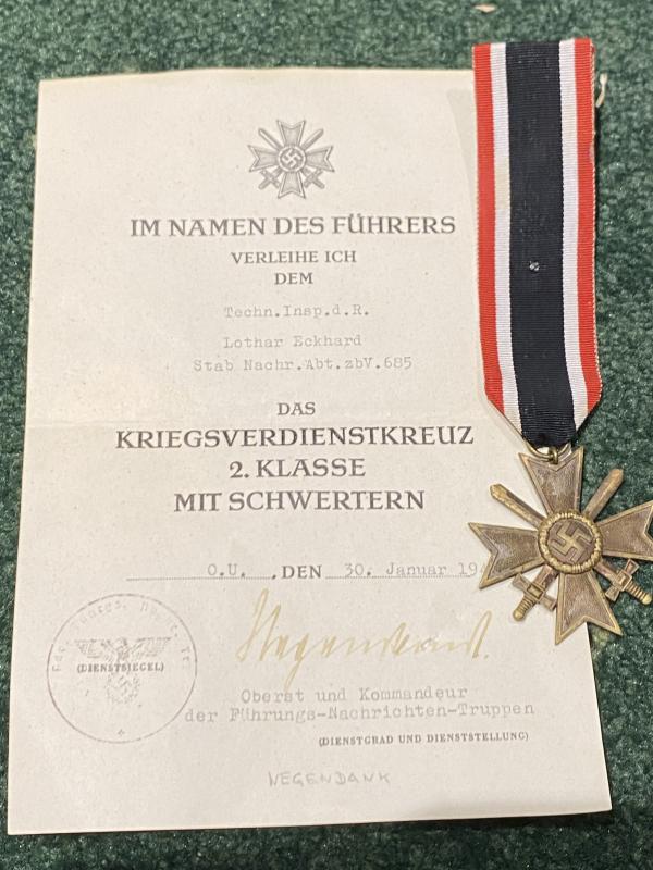 THIRD REICH WAR MERIT CROSS WITH SWORDS AND ORIGINAL AWARD CERTIFICATE.