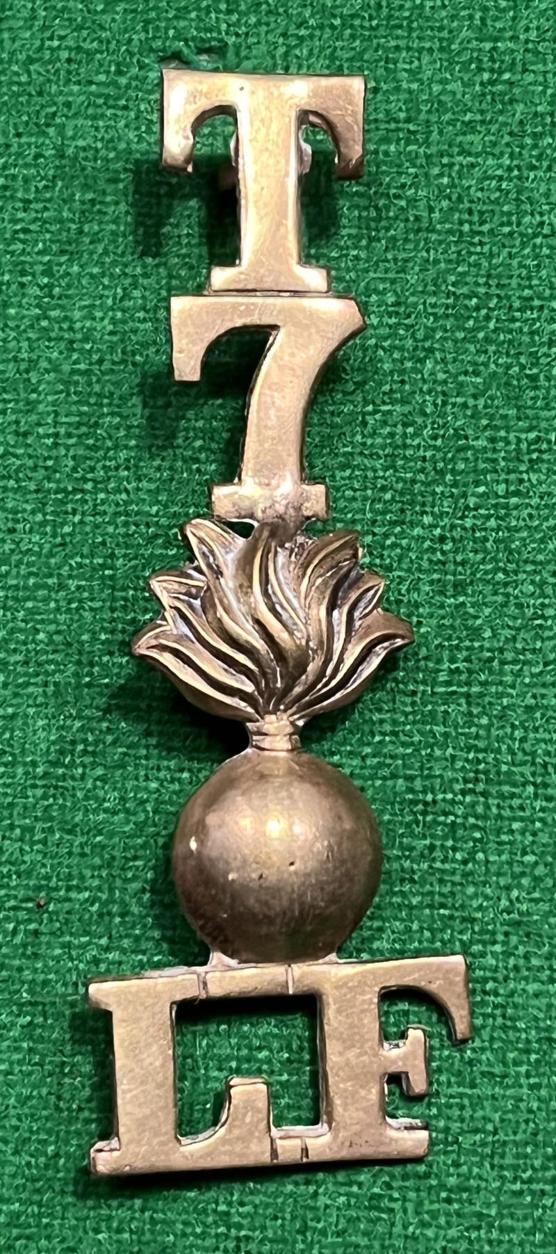 T 7 Lancashire Fusiliers. Brass shoulder title.
