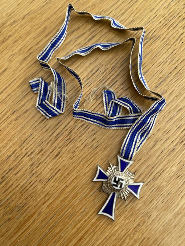 SILVER MOTHERS CROSS WITH FULL RIBBON.