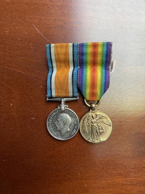 MINIATURE PAIR OF WW1 MEDALS MOUNTED FOR WEAR.