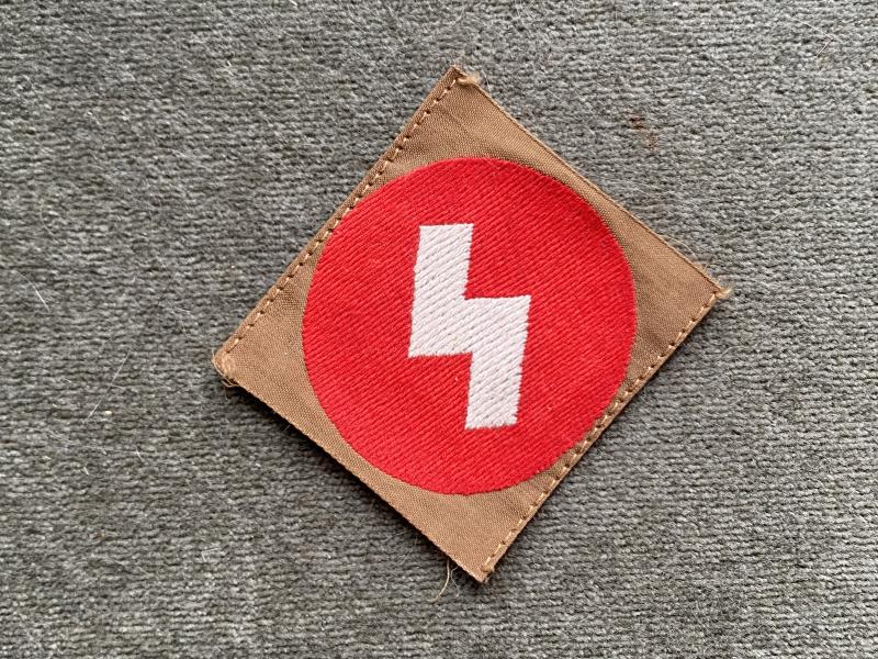 UNISSUED HJ SLEEVE BADGE WITH RZM LABEL.