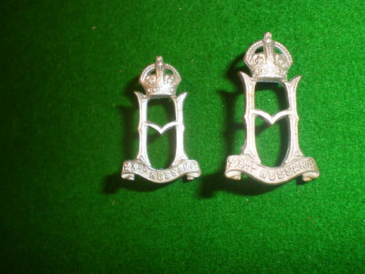 23rd Hussars collar badges.