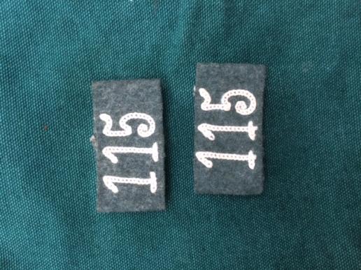 PAIR OF THIRD REICH SLIP ON REGIMENTAL NUMBERS.