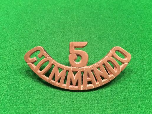 5 Commando brass shoulder title. 